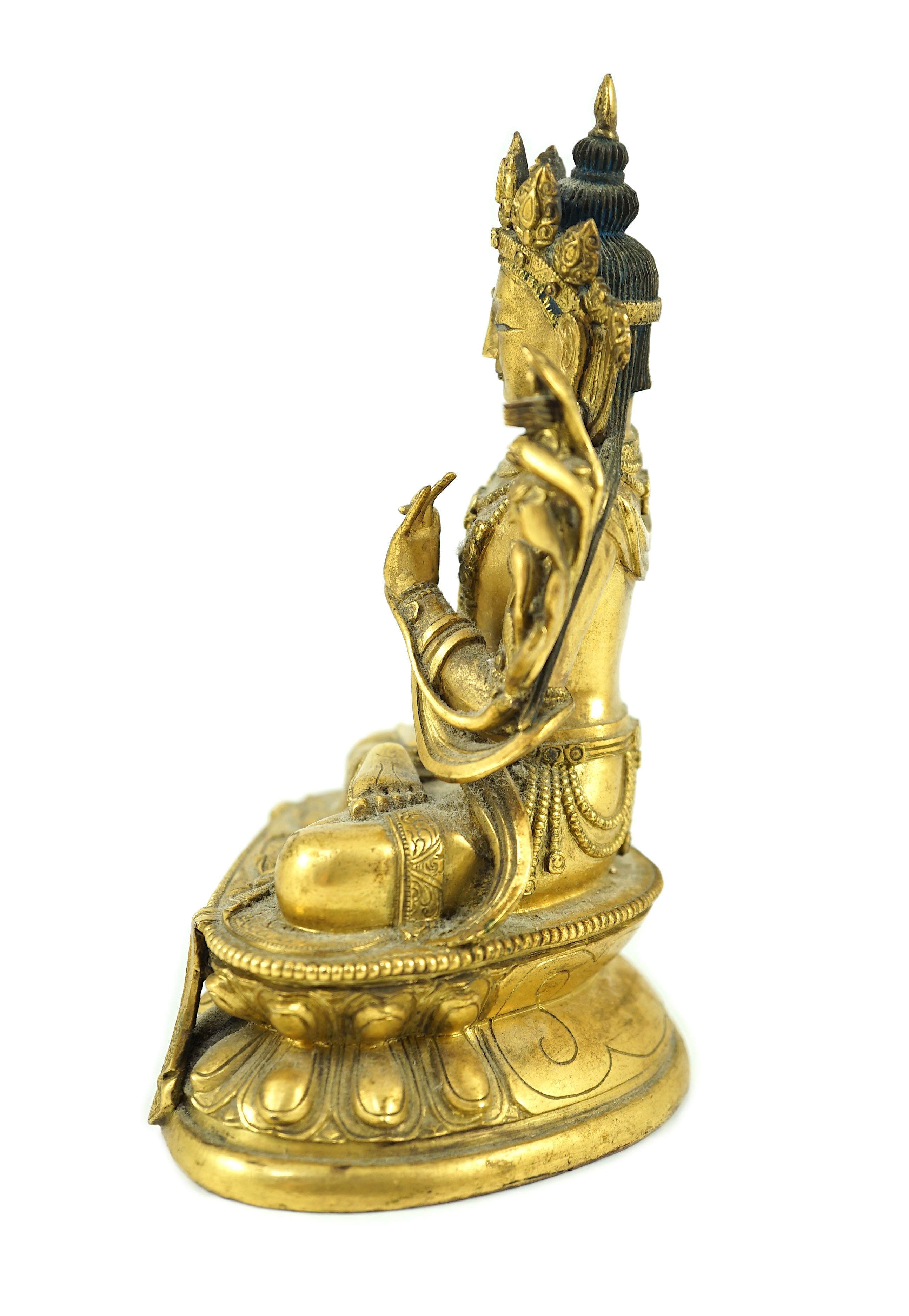 A Tibetan gilt bronze seated figure of Vajrasattva, 16.5 cm high